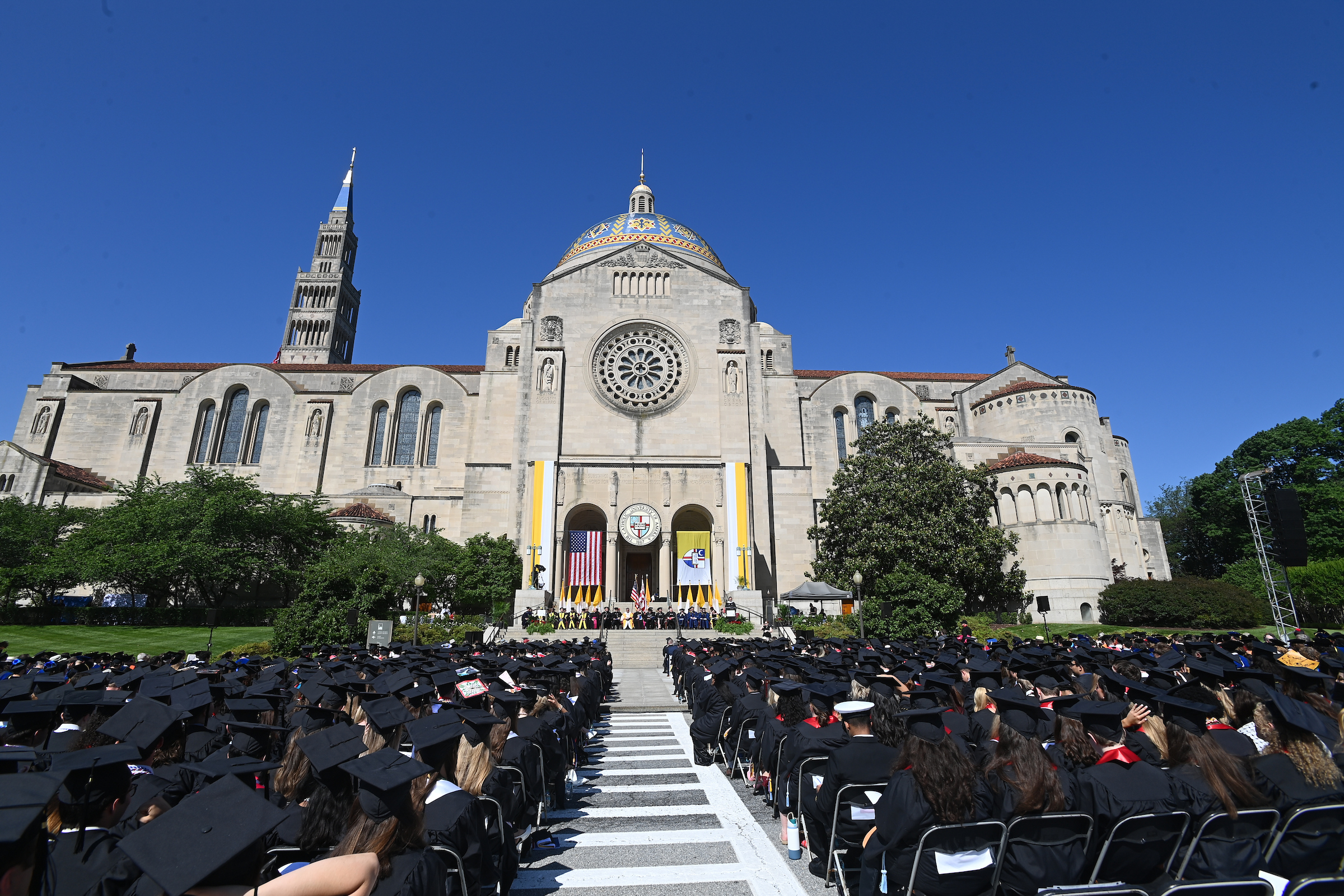 wide lens photo of graduates in a crowd